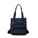 Mochila y cartera híbrida confeccionada en nylon de color beige con detalles y correas en negro. Posee dos asas superiores para llevar al hombro y correas traseras ajustables para usar como mochila. Presenta dos bolsillos frontales con cierre de cremallera y tiradores largos.