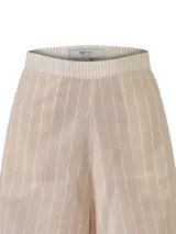 Short de tiro alto confeccionado en mezcla de lino y algodón orgánico, con diseño de rayas verticales en tonos beige y blanco. Presenta bolsillos laterales y cierre invisible.