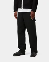 Pantalón de gabardina negro Carhartt WIP modelo Single Knee Pant, de corte recto y holgado con bolsillos laterales utilitarios.