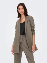 Blazer largo de punto elástico marca JDY, color beige, con cuello de solapas y diseño abierto sin botones.