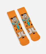 Medias de caña larga color naranja con estampado de Pedro Picapiedra. Confeccionadas en tejido de algodón con detalles en poliéster.
