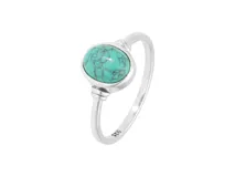 Anillo de plata 925 con piedra natural turquesa en forma ovalada y engaste liso.