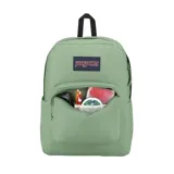 Mochila JanSport modelo Superbreak Plus en color verde menta, con compartimento principal con cierre, bolsillo frontal con organizador y correas acolchadas.