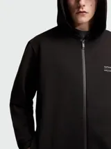 Campera Moncler de algodón con capucha, cierre frontal completo y logo estampado en el pecho. Presenta un diseño minimalista con puños y ruedo acanalados.