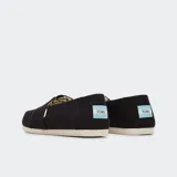 Alpargatas Toms de lona negra con elástico en el empeine y plantilla acolchada.
