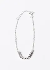 Pulsera de plata 925 con cadena fina y diez esferas plateadas.