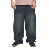 Pantalón de jean Quiksilver modelo Skater Ollie, color azul oscuro con efecto desgastado, de corte amplio y relajado tipo baggy.