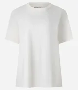 Remera boxy de manga corta y cuello redondo, confeccionada en algodón liso negro de corte holgado.