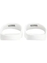 Ojotas blancas de Calvin Klein Jeans con logo CK en negro.