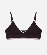Soutien top seamless texturizado color marrón oscuro con detalles en rosado y ribete blanco, tirantes finos regulables y copas desmontables.