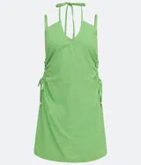 Vestido corto verde de lino con tirantes finos ajustables, escote halter con lazo y cutouts laterales con lazos.