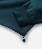 Buzo de cuello alto con medio cierre frontal, confeccionado en tejido de algodón con felpa. Presenta un corte boxy holgado, mangas largas con puños elásticos y una estampa gráfica circular en la espalda con la inscripción Off-Track Studio Company.