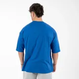 Remera negra de algodón, corte oversize, con inscripción 'GAINS.' en el frente.