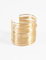 Pulsera rígida tipo brazalete de diseño abierto, compuesta por múltiples hilos metálicos superpuestos que crean un efecto de capas.