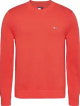 Sweater rojo de algodón orgánico, con cuello redondo, puños y bajo de punto canalé. Tiene corte slim y parche con el logo de Tommy Jeans en el pecho.