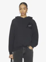 Hoodie oversize de algodón fleece color negro, con bolsillo frontal tipo canguro y gráfico de la marca Anine Bing en el pecho.