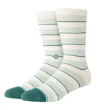 Medias tipo crew de la marca Stance, con diseño de rayas horizontales en tonos crema y verde menta. Presentan puntera y talón reforzados en color verde oscuro, con el logo de la marca bordado en el lateral.