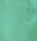 Pollera larga color naranja, de corte recto y con volados en diagonal en el frente.