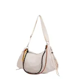 Cartera bandolera color beige, confeccionada en material sintético suave, con cierre superior, correa ajustable y detalles de cordones decorativos en colores contrastantes.
