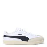 Championes Puma 9 T de cuero blanco con detalles en verde y suela de goma color caramelo.
