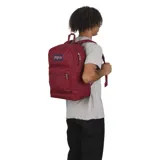 Mochila Jansport color borgoña, con un compartimento principal, bolsillo frontal con cierre, bolsillo lateral para botella de agua y sobre interno acolchado para laptop de 15 pulgadas.