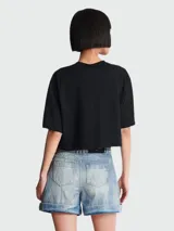 Remera corta negra de algodón con logo Balmain Paris estampado en blanco.