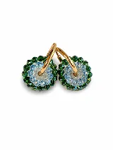 Aros argollas de plata con dijes colgantes circulares decorados con cuentas de cristal facetado en tonos naranja y gris.