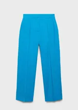 Pantalon de vestir color turquesa, de corte recto y tiro medio, con cierre frontal de botón y cremallera, y bolsillos laterales.