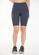 Calza biker deportiva de compresión color azul marino, de cintura alta con recortes y bolsillos laterales.