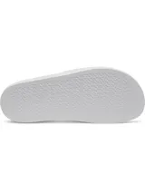 Sandalias Under Armour modelo Armour Slide Lite, color blanco con diseño moldeado de una sola pieza y textura en la tira superior, que incluye el logo de la marca en color negro.