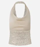 Top sin mangas color beige claro, con escote drapeado (degagê) y confeccionado en tejido de lentejuelas.