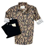 Camisa de manga larga color marrón con estampado de hojas negras, cuello clásico y puños con interior estampado.