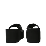 Sandalias de plataforma alta tipo flip-flop, de color negro, con base gruesa y ligera de estilo retro.