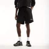 Short New Balance modelo Trackside, color negro, con cintura elástica y logo reflectante de la marca en la pierna izquierda.