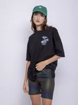 Calza ciclista negra con destellos metalizados y degradé de colores.