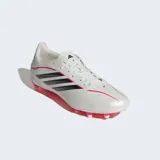 Championes de fútbol Adidas modelo Copa Pure IV League para terreno firme, en color blanco perlado con las icónicas tres tiras en negro y detalles en fucsia. Presentan un diseño aerodinámico con suela técnica de tacos para tracción óptima.