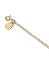 Collar dorado de doble cadena fina, con dije de flor.