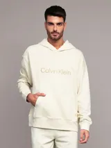 Buzo con capucha Calvin Klein de felpa de algodón color beige, de corte relajado, con bolsillo tipo canguro y logo bordado en el pecho.