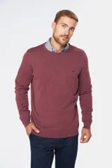 Buzo de punto color verde oscuro, con cuello redondo y mangas largas.