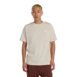 Remera color beige de algodón, corte clásico, manga corta y logo New Balance estampado en el pecho.