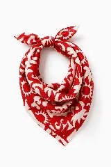 Pañuelo cuadrado de tela con estampado de soles y formas abstractas en color rojo y crema.