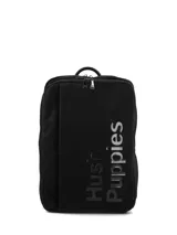 Mochila urbana Hush Puppies color negro, con diseño minimalista, cierre superior con doble cremallera y logo de la marca en relieve en el frente.