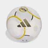 Pelota de fútbol adidas, modelo Match Ball Replica Club, con diseño principal blanco y detalles gráficos en dorado y amarillo. Presenta el escudo del Real Madrid estampado.
