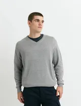 Sweater de punto con cuello en V y mangas largas, diseño clásico de calce regular.