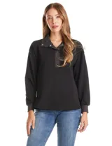 Buzo de modal color negro con cuello solapa y escote en V con botones a presión. Presenta mangas largas con puños elastizados y detalles de textura en el cuello y puños.