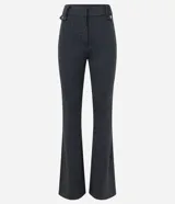 Pantalón flare de punto roma con estampa de cuadros, trabillas en la cintura, cierre delantero y detalles de solapa con botones.