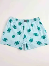 Bóxer de algodón blanco con estampado de flores pequeñas color celeste, con cintura elástica y logo de la marca en el centro.