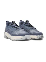 Championes de entrenamiento Under Armour Project Rock 8, color azul con detalles en beige y gris. Presentan una parte superior de malla técnica con detalles de gamuza, amortiguación reactiva UA HOVR y tecnología UA TriBase para mayor estabilidad y contacto con el suelo.
