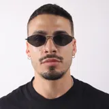 Lentes de sol con armazón metálico dorado de diseño geométrico hexagonal y cristales oscuros con protección UV400.