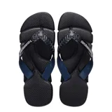 Sandalias tipo ojotas Havaianas modelo Power 2.0, color negro con detalles en rojo. Presentan una suela con textura antideslizante y tiras anchas con diseño geométrico y logo de la marca en relieve.